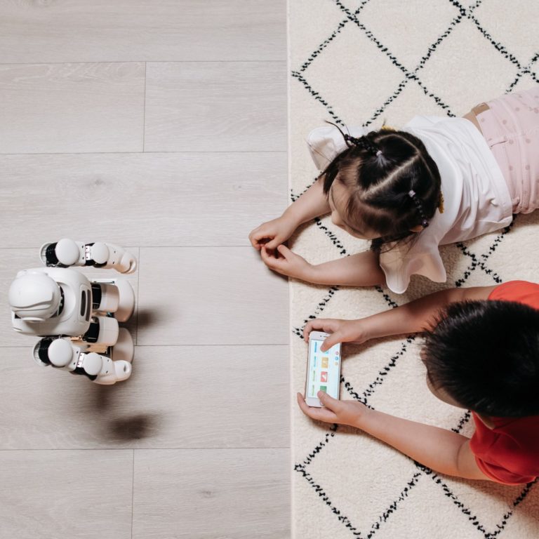 kids playing with robot